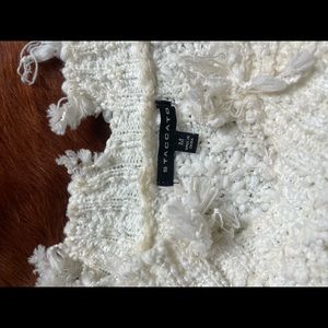 White sweater. Size medium. Lots of life left.